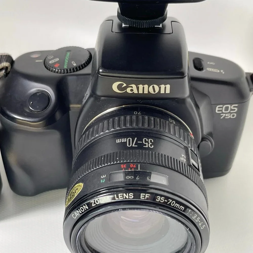 Canon E05 750 35mm camera and Nikon Fun touch 2 35mm camera
